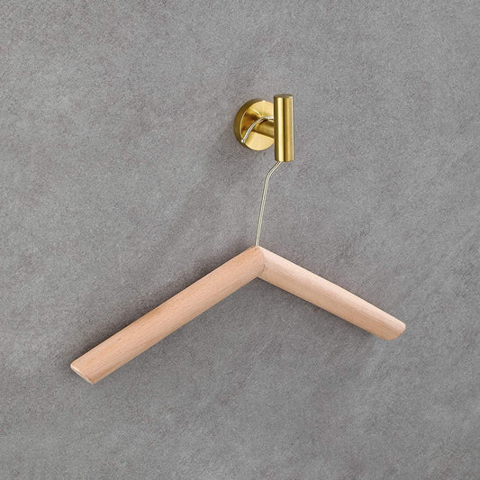 Close-up of a natural wood clothes hanger, showcasing its smooth finish.