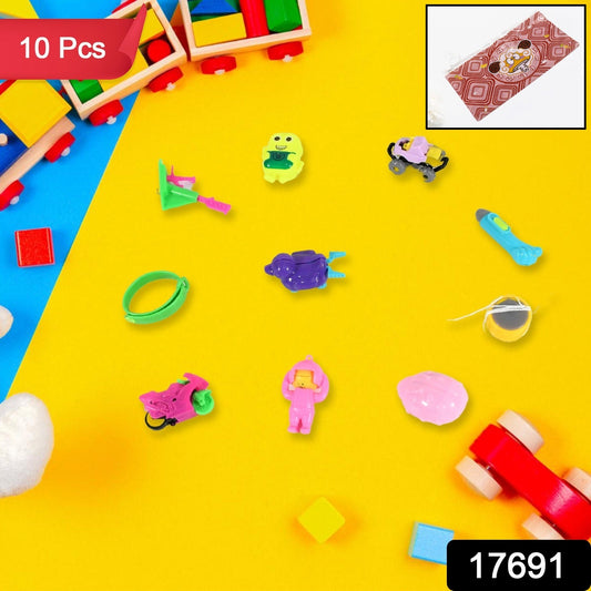 Close-up of several small, colorful activity toys from the 10-in-1 set, including a puzzle and whistle.